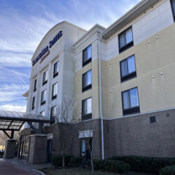 Exterior of a multi-story SpringHill Suites by Marriott hotel.