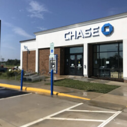 Chase bank branch office exterior with a parking lot in the foreground.